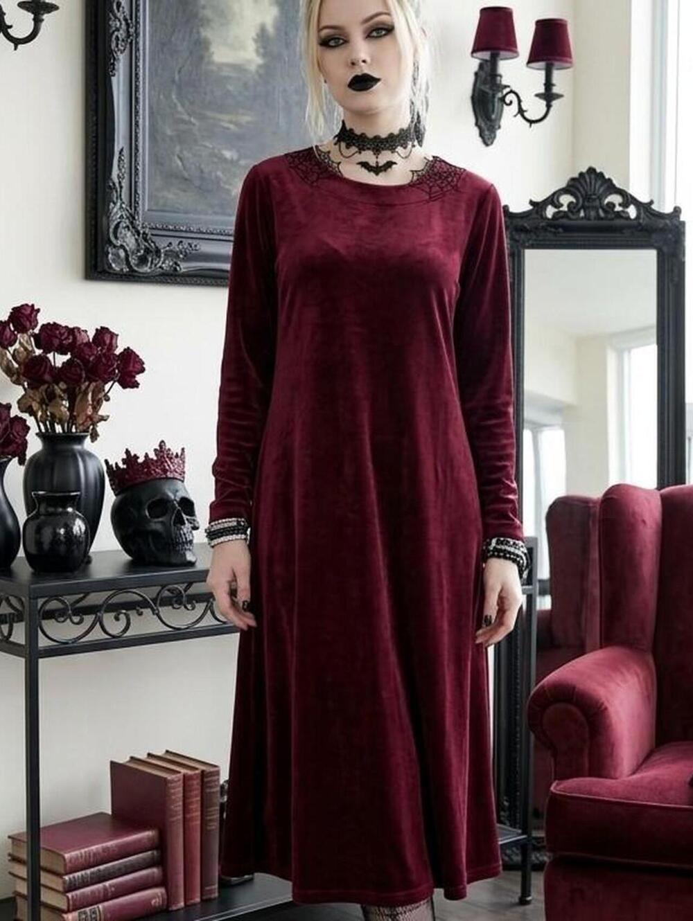La Cera red velvet maxi dress with long sleeves and a scoop neckline. Size: S